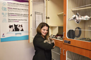alexis holding a kitten in kitty city